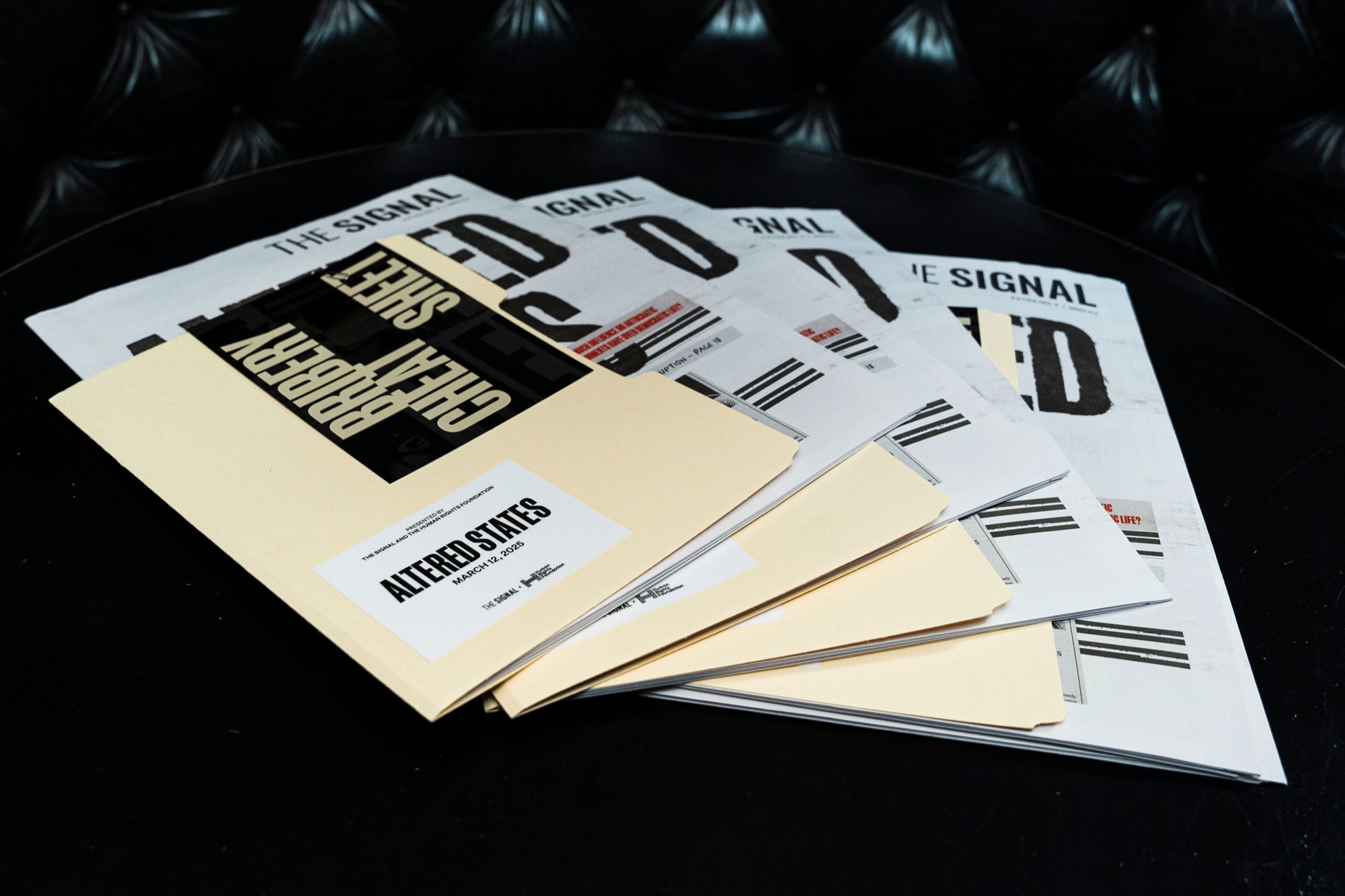 Kleptocrats Dossier folders and Altered States newspapers produced with The Signal