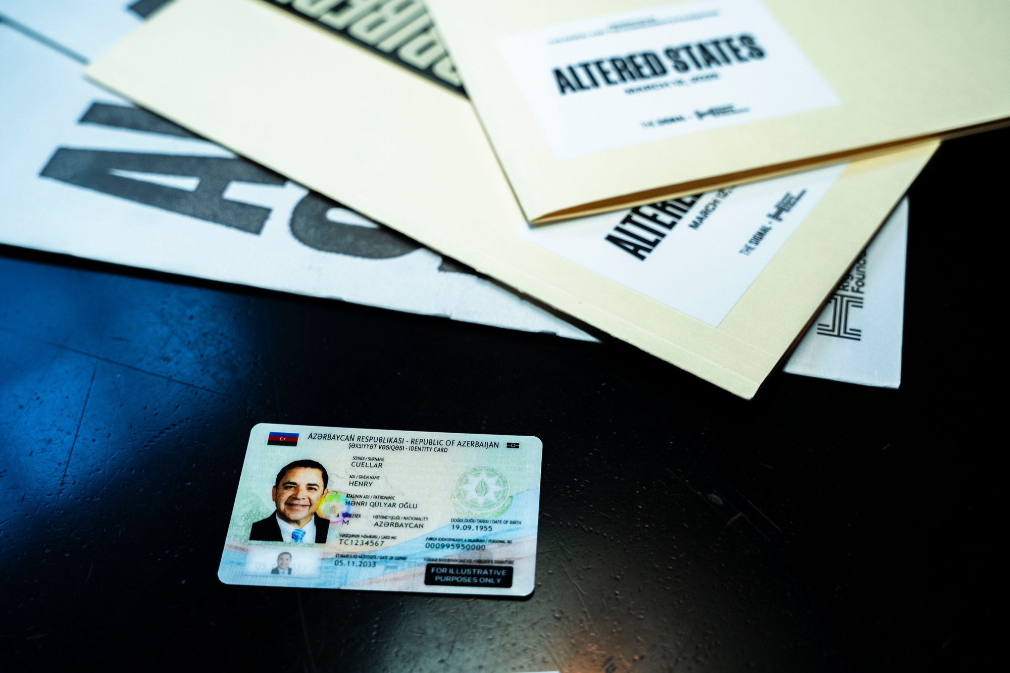Fake foreign-government ID card of a U.S. congressman with the Kleptocrats Dossier folders